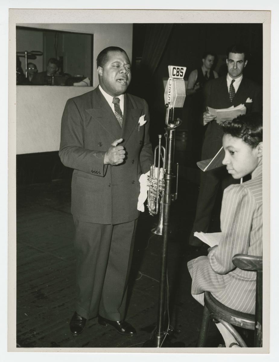 Photograph of Louis Armstrong recording at the CBS Studio in New York