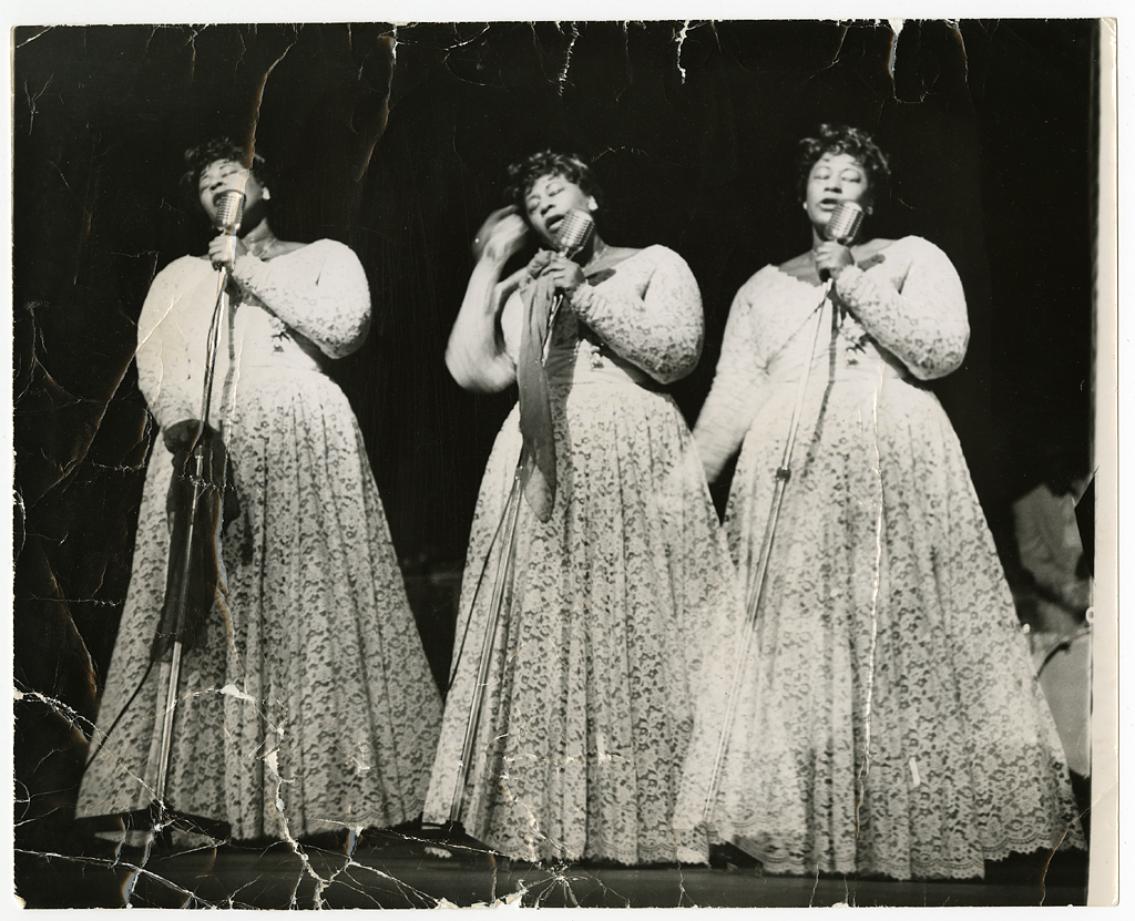 Triple-image (triple-exposure) picture of Ella Fitzgerald in concert, undated, Ella Fitzgerald Papers, ca. 1935-1996, Archives Center, National Museum of American History. 